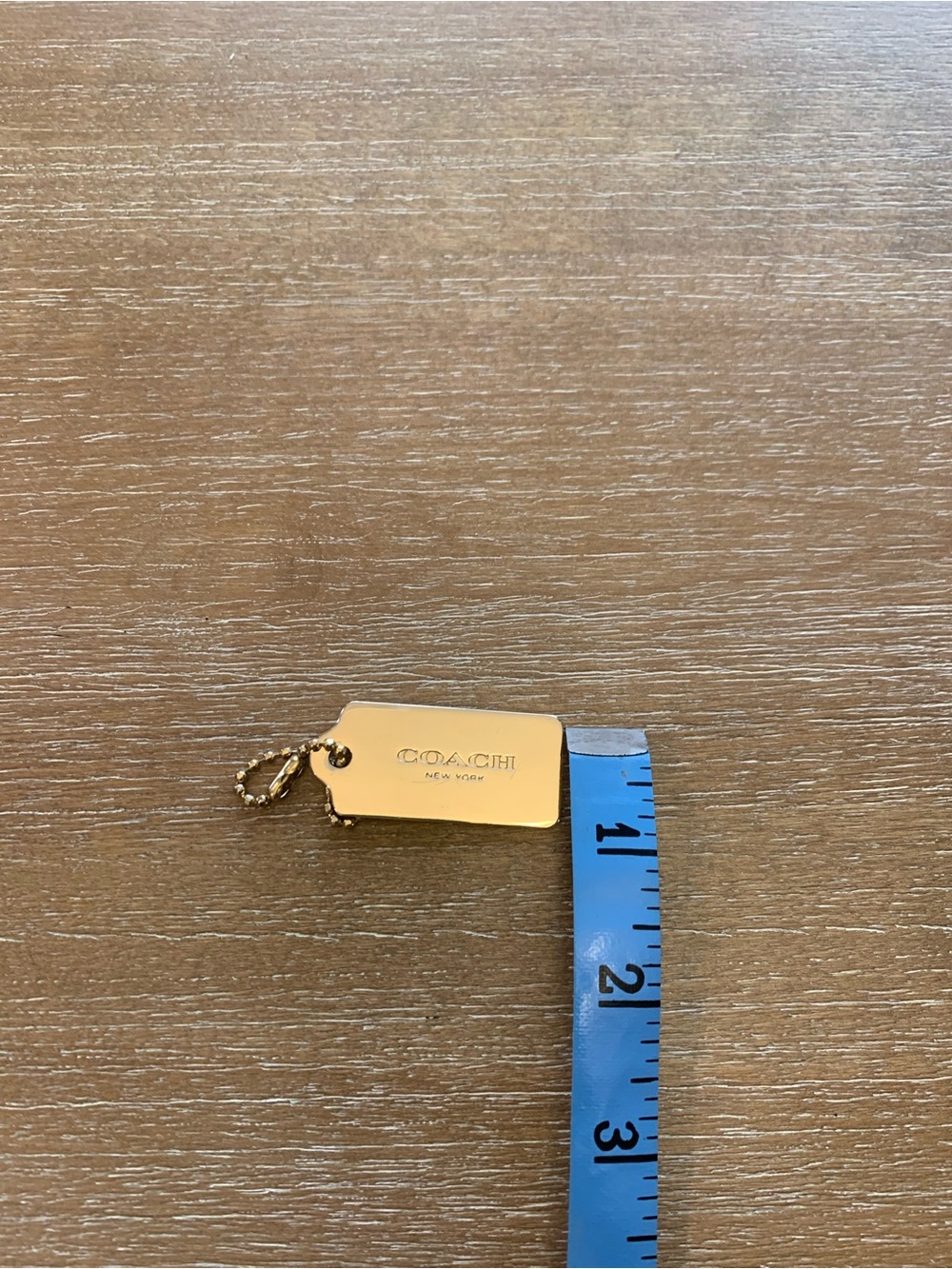 Coach Gold-Tone hang tag